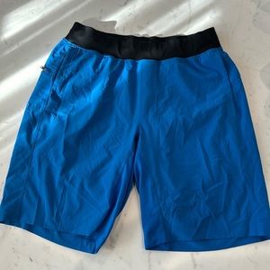 Never worn Lululemon men THE SHORT 10” inseam Color blue Size M linerless